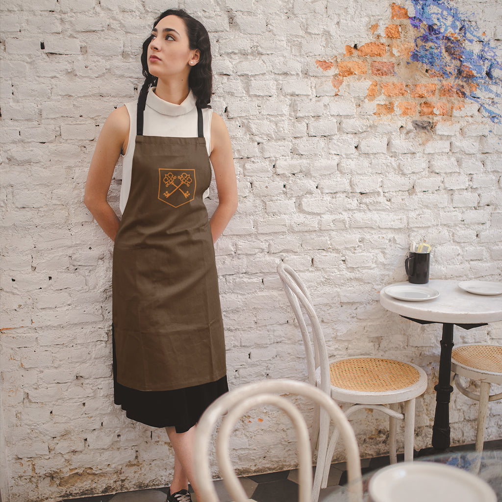 The Inheritance Crest in Brown Apron