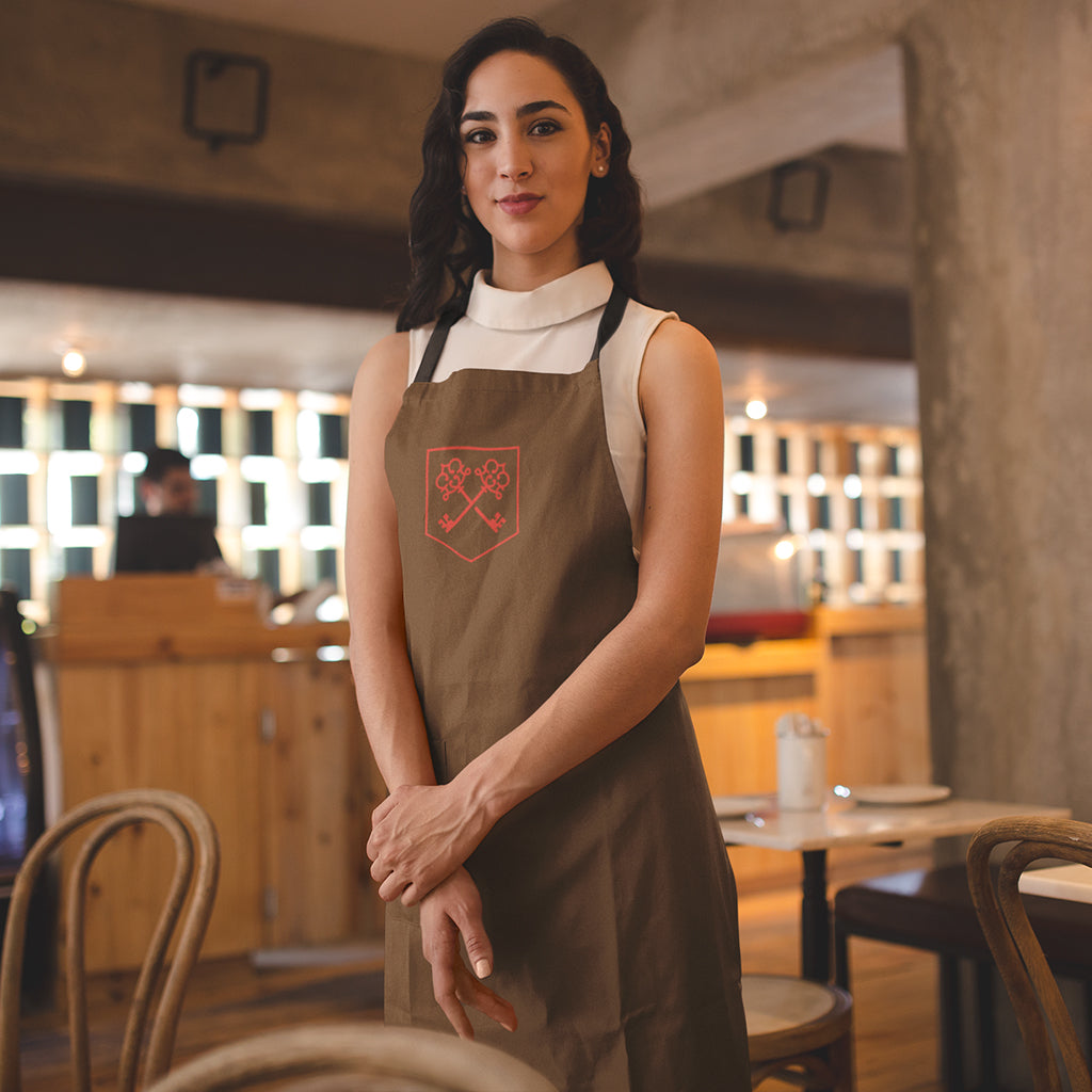 The Inheritance Crest in Brown Apron