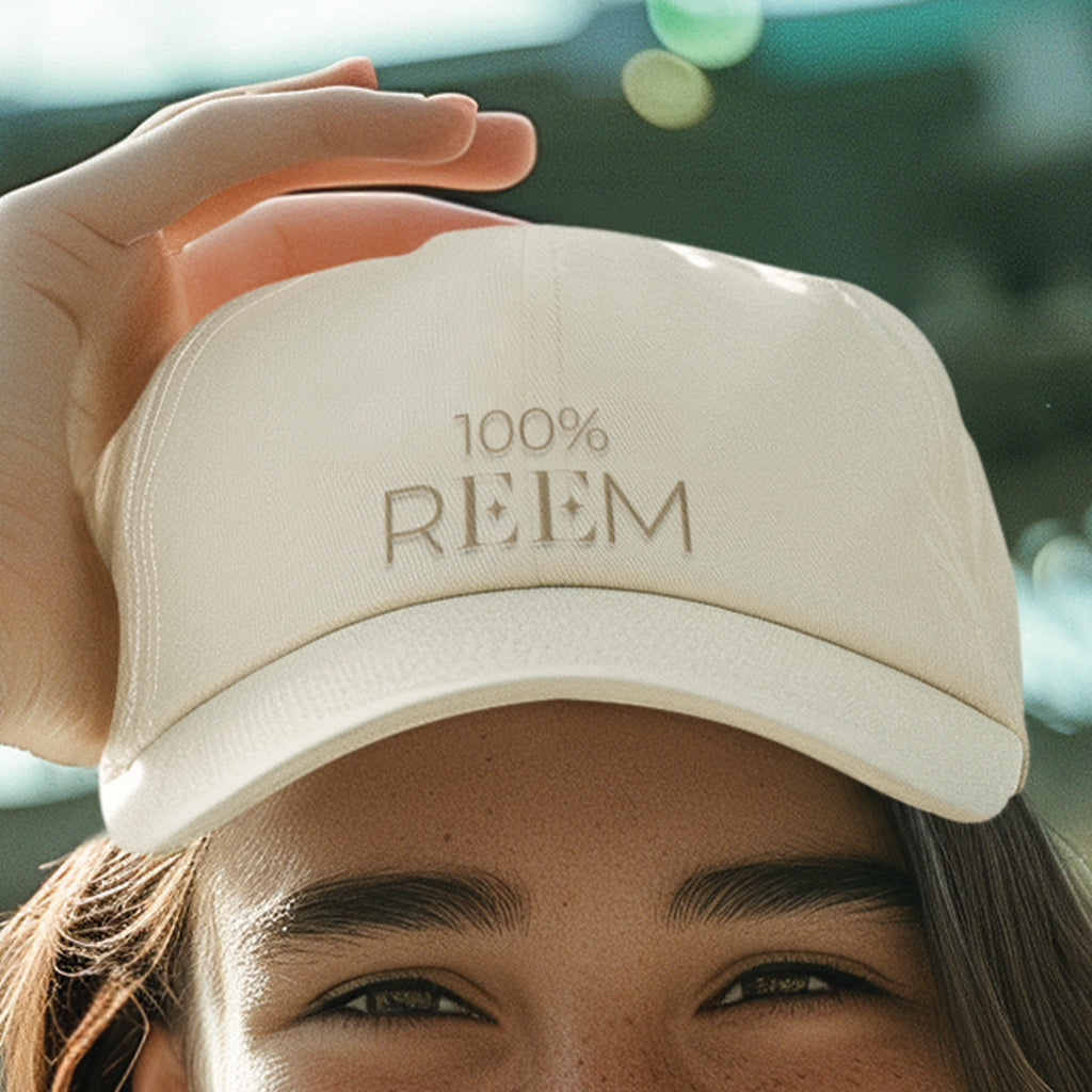 100% REEM Embroidered Cap